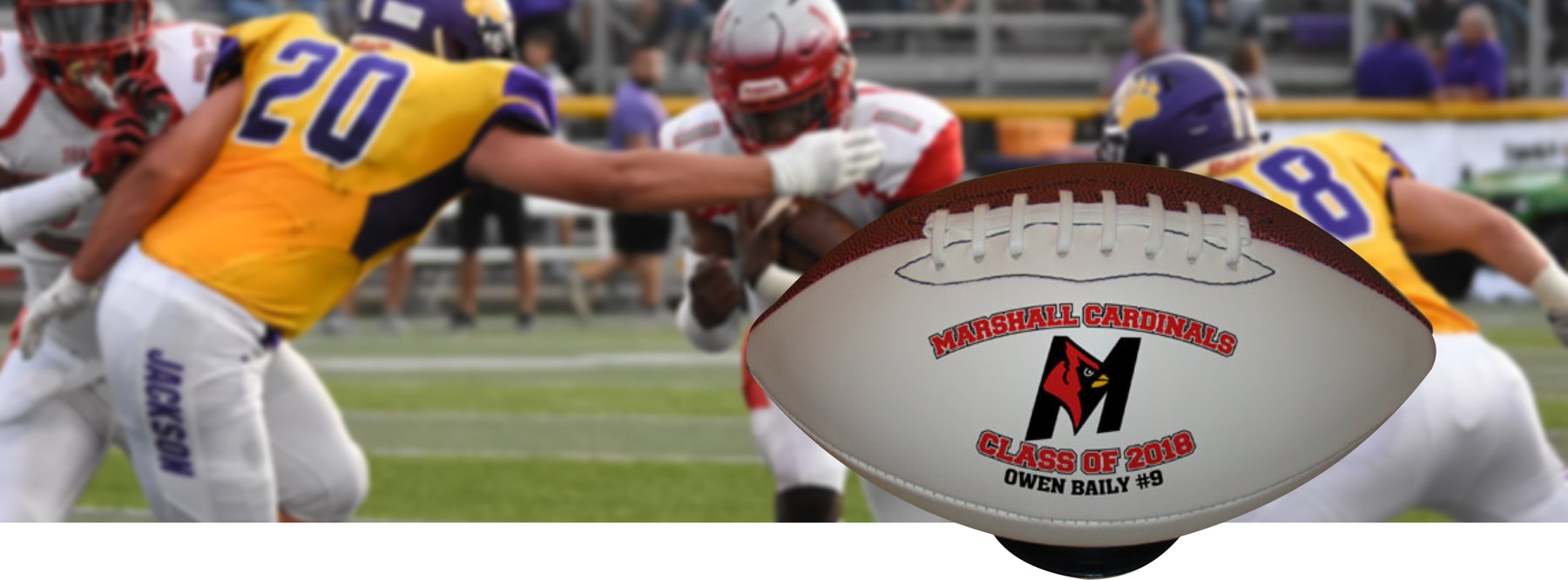 High school football team player running with the football with a large-personalized football on a stand on top of the photo, photo by Chris Chow on Unsplash