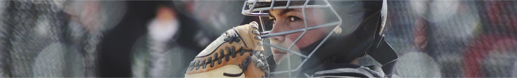 High School Softball Team Senior Player With Catchers Mask Looking Con