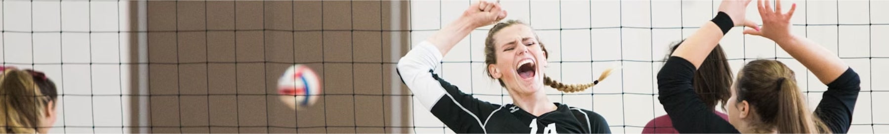 High School Senior Volleyball Team Spiking the Final Point Of Their St